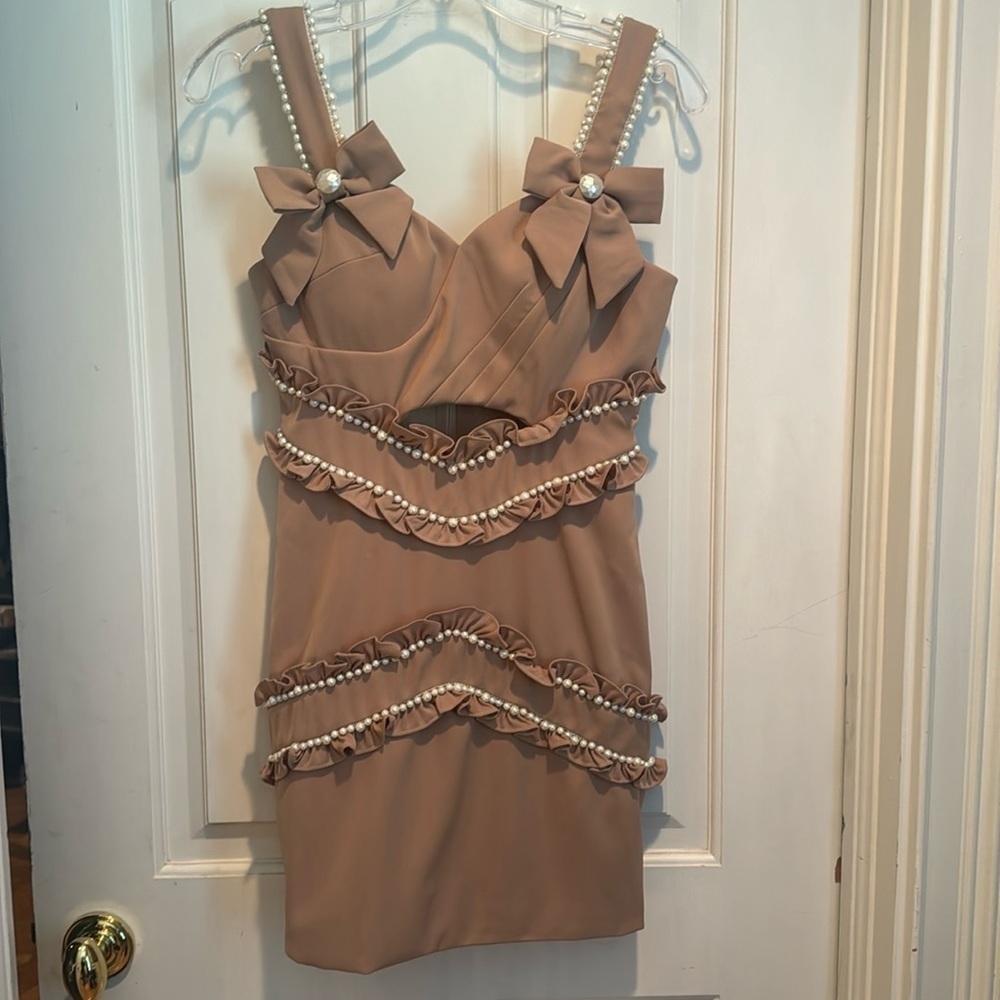 BLT tan dress with pearls.